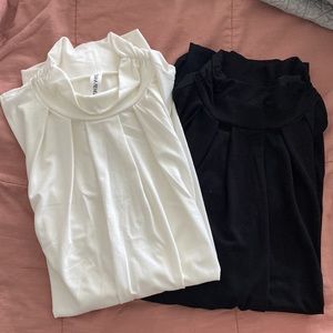 Two Zenana Premium mock neck sleeveless shirts. 1-black, 1-ivory